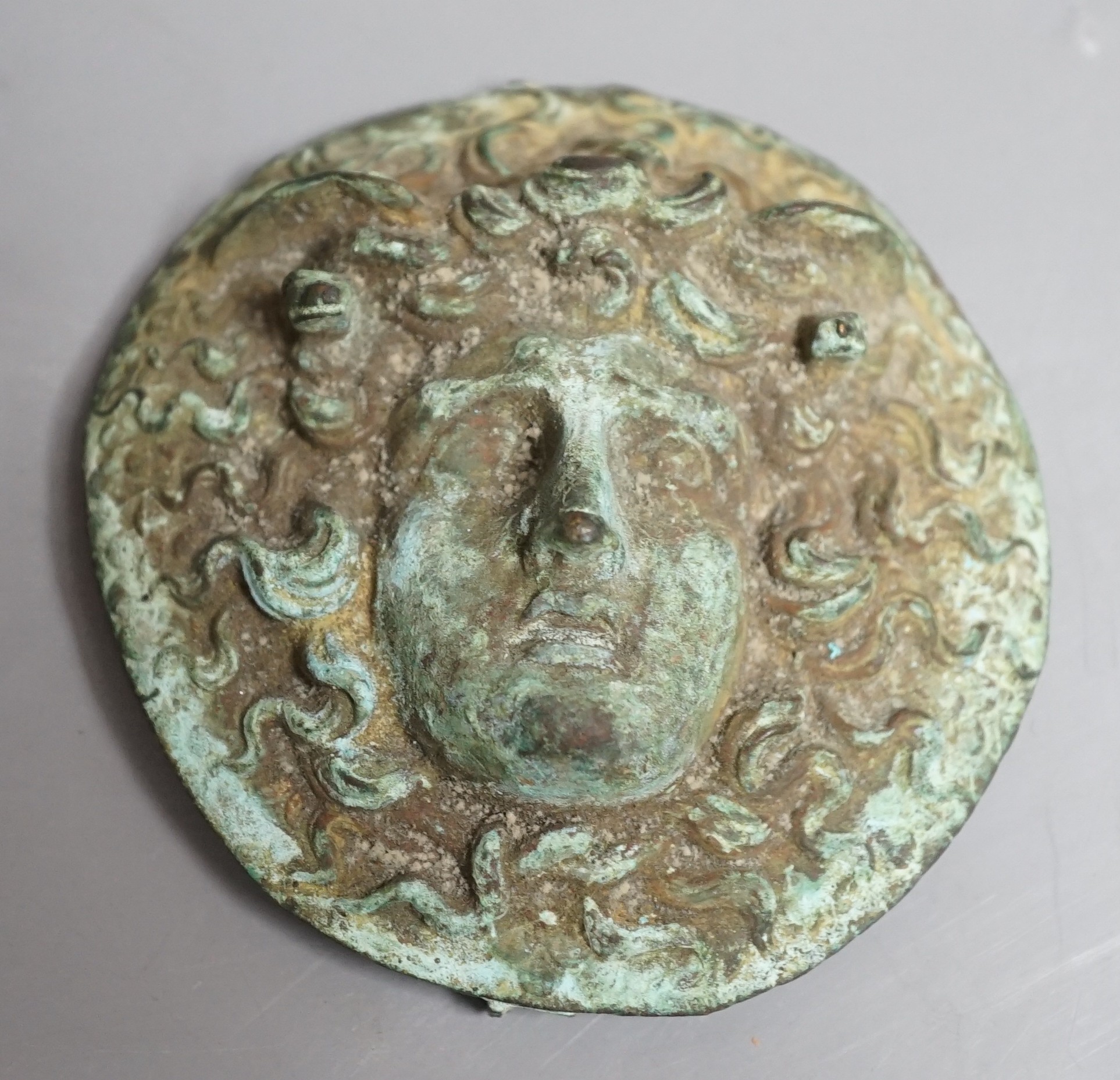 A cast bronze grand tour souvenir phalera of Hermes, 8.5cm diameter